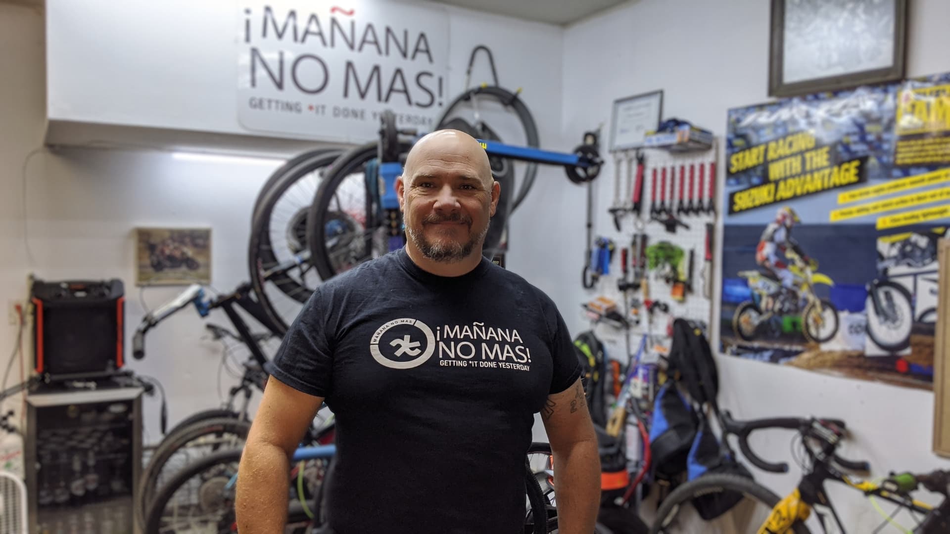 Kurt Von Ahnen in the Mañana No Más shop, surrounded by bikes and tools